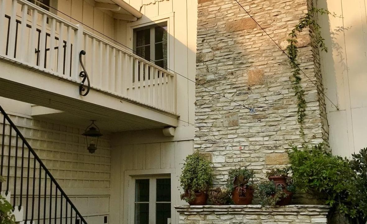 Potted plants acclimating outside on a protected patio